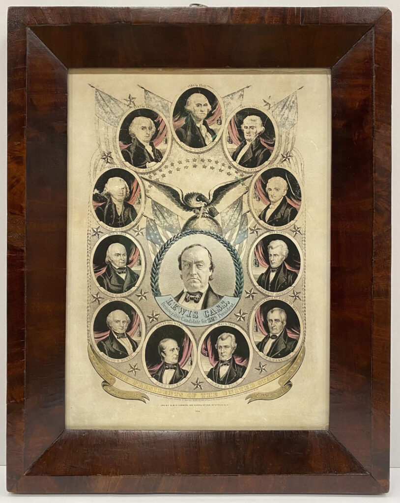 After treatment. The framed lithograph by Nathaniel Currier depicting 1848 Democratic Presidential Candidate Lewis Cass with an eagle perched upon a globe flanked by American flags directly above him surrounded by a border of oval portraits of the previous eleven American presidents after conservation treatment of the frame and the print. The antique frame appears to be original to the print.