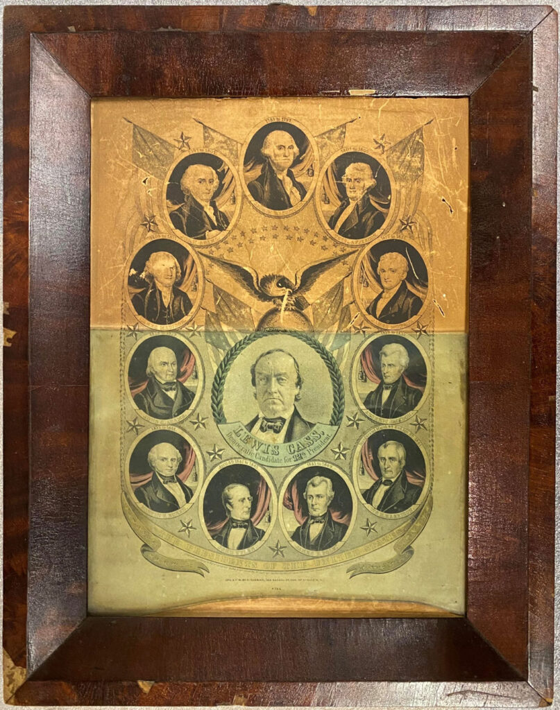 Before treatment. A framed antique lithograph by Nathaniel Currier depicting 1848 Democratic Presidential Candidate Lewis Cass with an eagle perched upon a globe flanked by American flags directly above him surrounded by a border of oval portraits of the previous eleven American presidents in a state of severe degradation.
